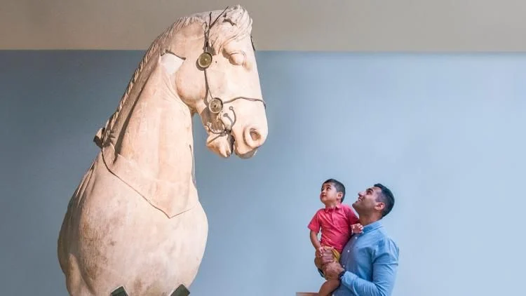 Family activity in a museum gallery